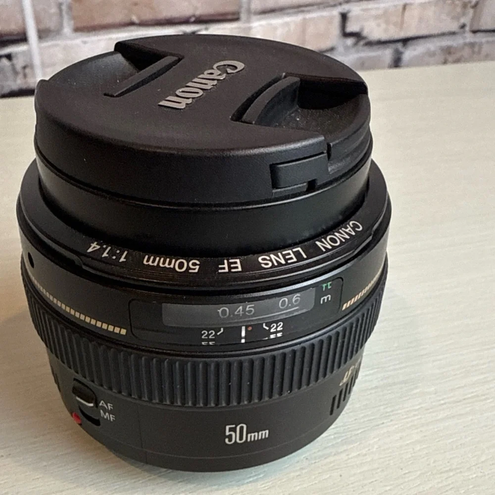It’s the Canon EF Nifty 50! 1.4 EF